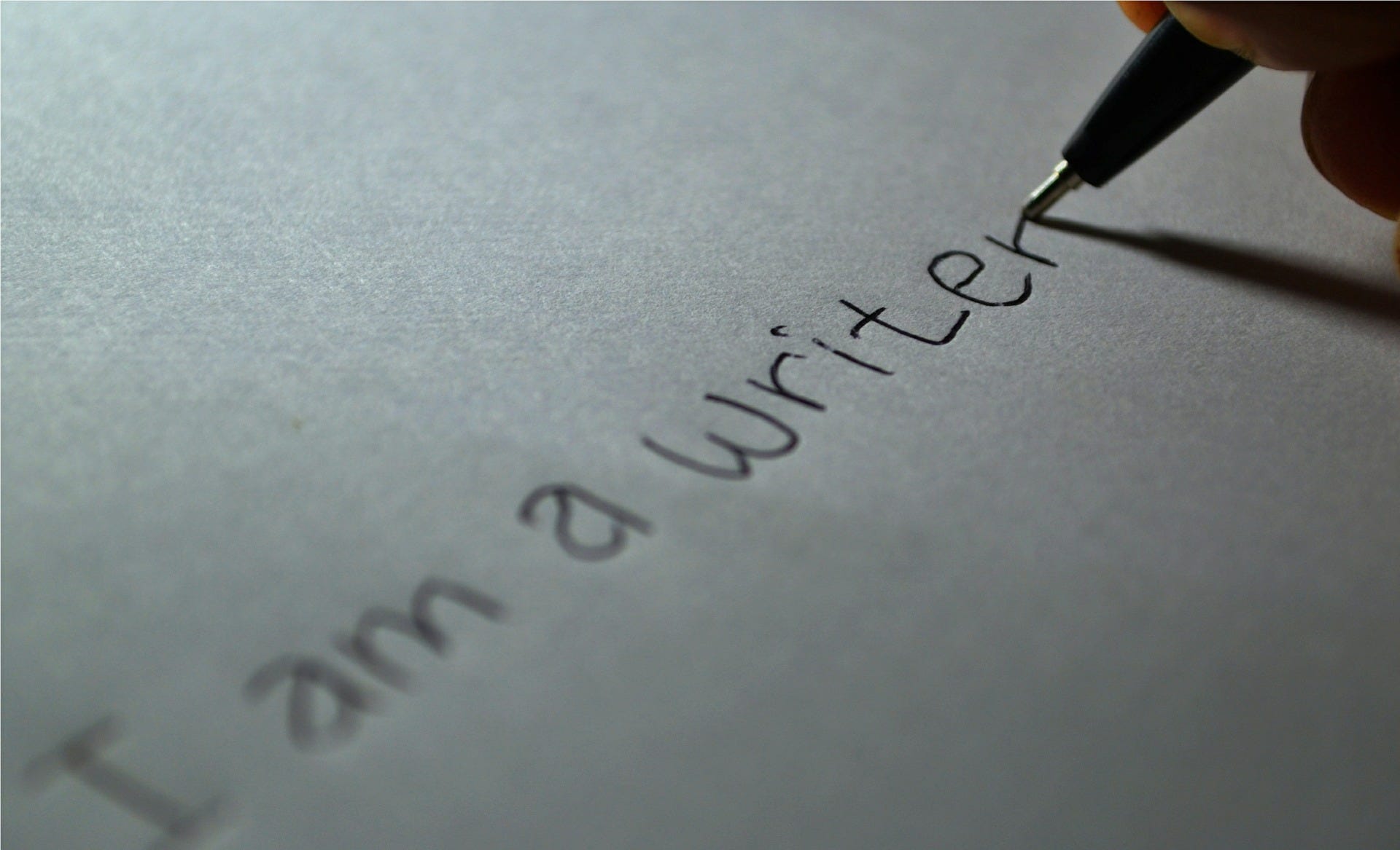 The words I am a writer written on a piece of paper